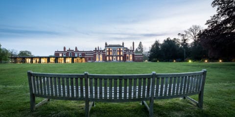 Image of Hinxton Hall and lawns at dusk Image of Hinxton Hall and lawns at dusk